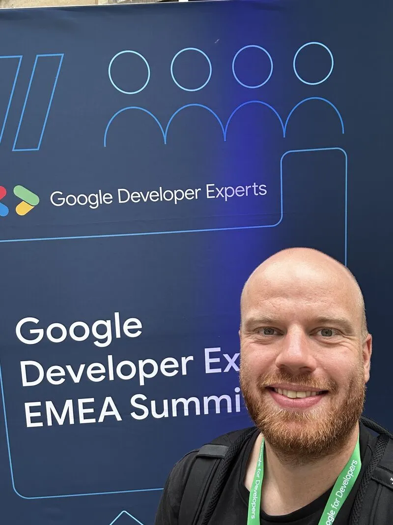 Dave in front of a banner that says "Google Developer Expert Summit"